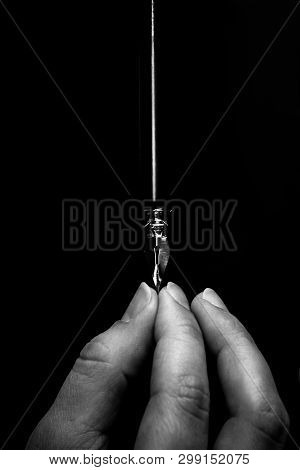 Female Hand Elegantly Holding An Ink Pen With A Metal Tip Close-up On A Black Background. Classic Fo