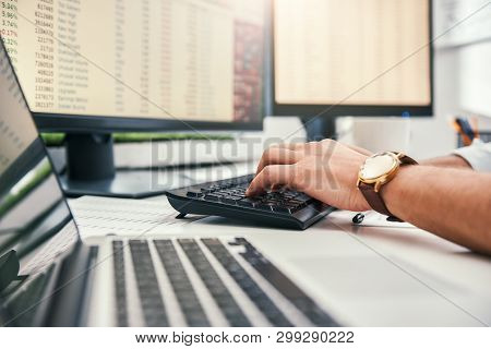 Trading Online. Cropped Photo Of Male Traders Hands With Watch On His Wrist Working On Computer And 