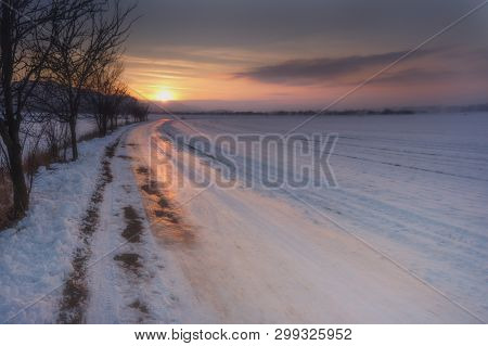 Winter Landscape.
Sunset Over The Winter Landscape.
Snowy Path.winter Landscape Snowy Path And Sunse