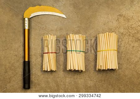 Yellow Sickle On Concrete Floor