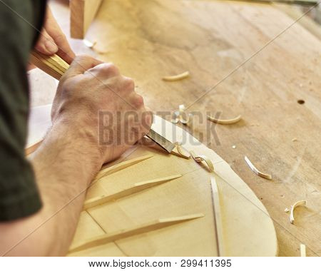 Lautner Makes A Classic Guitar. Luthier Gives A Chamfered Shape To The Brace.