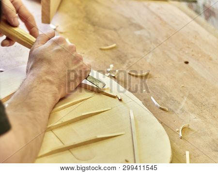 Lautner Makes A Classic Guitar. Luthier Gives A Chamfered Shape To The Brace.