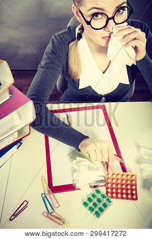 Sickness And Diseases At Work. Young Unhealthy Businesswoman With Tissue Having Flu Grippe. Secretar