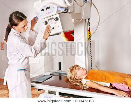 Little girl with doctor radiologist.