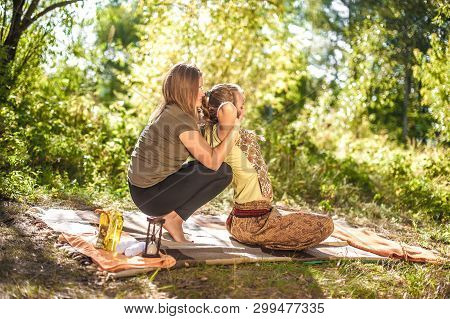 Massage Professional Demonstrates Refreshing Massaging Methods In A Forest Clearing.