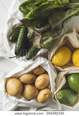 Zero Waste Concept. Textile Ecologiical Shopping Bags With Fruits And Vegetables On White Background