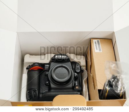 Paris, France - Feb 28, 2017: Directly Above View Of Cardboard Unboxing With New Professional Nikon 