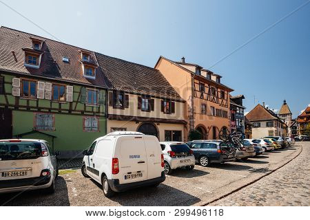 Bergheim, France - 19 Apr 2019: Large Group Of Cars Parked In Front Of The Half Timbered Houses In C