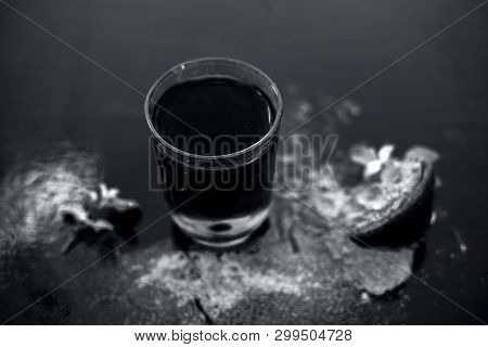 Ayurvedic Herb Brahmi Or Waterhyssop With Its Herbal And Beneficial Extract  In A Transparent Glass