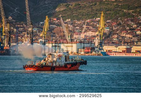 Red Tug Ship Going Through Black Sea Coast Bay.
