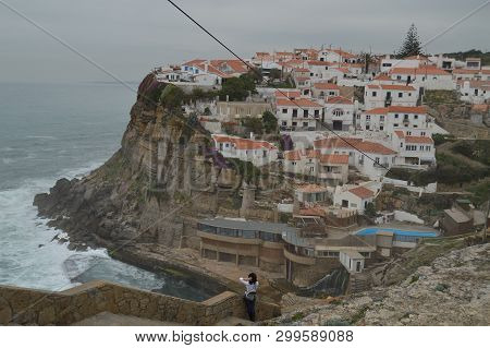 Pretty Woman Enjoying The Views Of The Houses Perfectly Located On A Cliff And With A Natural Pool O