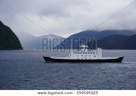 Car Ferry On A Cloudly Day In Norway
