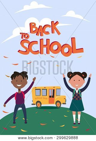Schoolboy And Schoolgirl Of Different Races Stand On The Background Of The School Bus, Back To Schoo