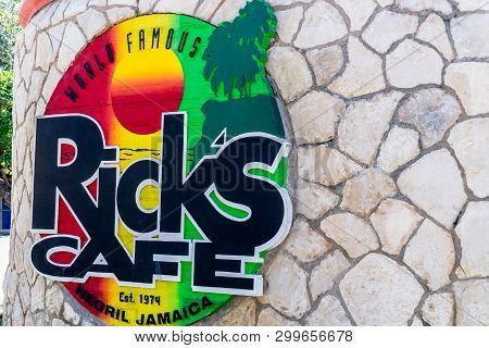 Negril, Jamaica - February 15, 2019: Sign At Brick Wall Entrance To Ricks Cafe, A Famous Sports Bar 