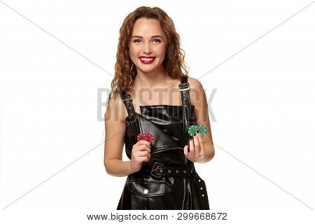 Casino Concept. Portrait Of Young Pretty Caucasian Woman, Playing In Casino. Roulette, Poker Chips, 