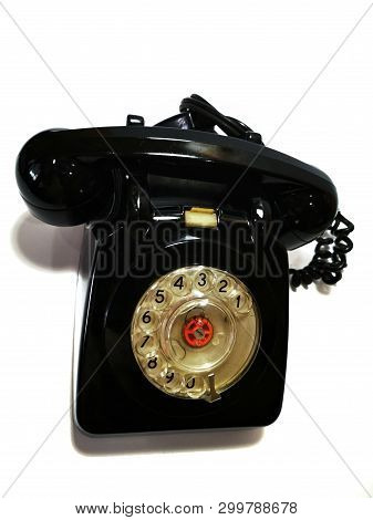 A Vintage And Antique Telephone With White Background.