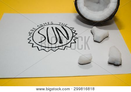Hello Summer Concept.  A White Paper Where Is Wtitten With Nice Handwriting - Here Comes The Sun. Su