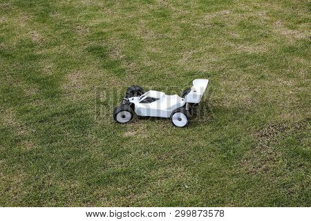 View Of R/c Model  Racing Cars On Green Background. Toys With Remote Control. Free Time Children And