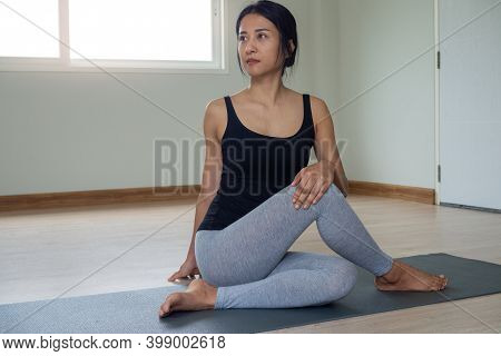 Women Are Doing Seated Twist Exercises For Health And A Firmer Body. Yoga Concept