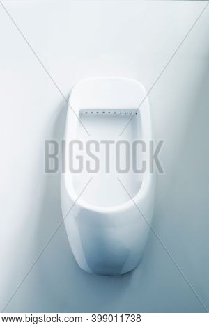 Public Toilet, Clean, Modern, White Tiles Convenient Urinal Concept.