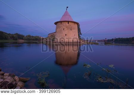 View Of The Flat Tower Of The Pskov Kremlin On July Twilight. Russia