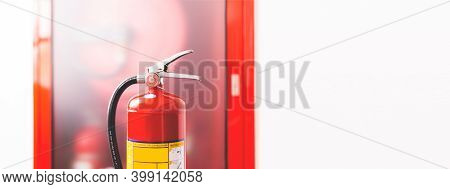 Red Fire Extinguisher Available In Case Of Fire Emergency.