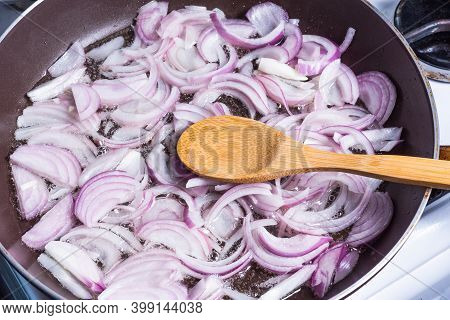 Red Onion, Cut Into Half Rings, Fried In A Pan