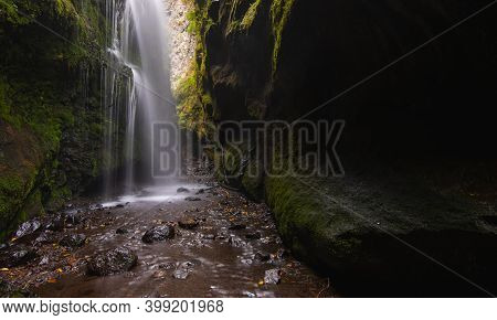 Waterfall With Polished Green Walls