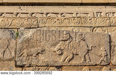 Hampi, Karnataka, India - November 4, 2013: Mural Sculpture On Brwon Stone At Royal Enclosure. Hunti