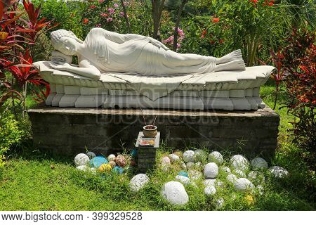 Statue Of Sleeping Buddha At Vihara Dharma Giri, Buddhist Temple In The Village Of Pupuan In Tabanan