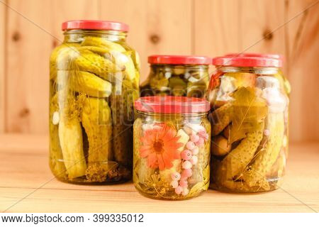 Pickled cucumbers in a jar. Autumn harvesting. Pickled and salted vegetables. Preservation for the winter. Summer country hobby.