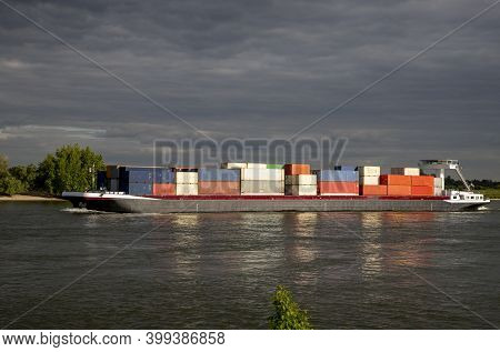 Inlandshipping Container Vessel Transportation Containers Over The River In The Netherlands Waal Riv