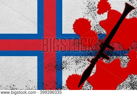 Faroe Islands Flag And Black Rpg-7 Rocket-propelled Grenade Launcher In Red Blood. Concept For Terro