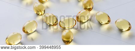 Shiny Fish Oil Nutrition, Omega 3, 6, 9 For Good Health Lie In The Shape Of The Sun Closeup. Prevent