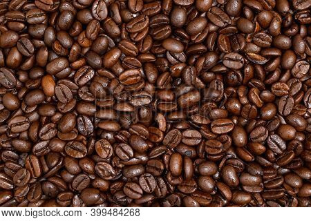 Background Of Roasted Coffee Beans From Close Up