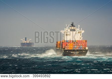 Strait Of Gibraltar - April 07, 2020. Cargo Boat Seaspan Ningbo Sailing In Waves During Strong Wind