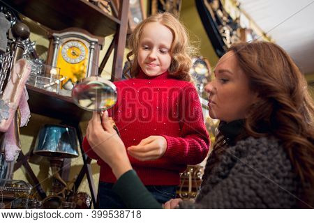 Having Fun. Cheerful Family, Mother And Kids Looking For Home Decoration And Holidays Gifts In House