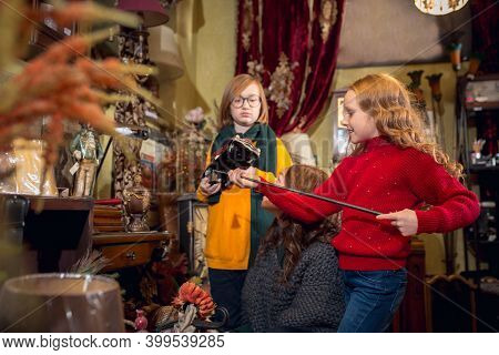 Toys. Cheerful Family, Mother And Kids Looking For Home Decoration And Holidays Gifts In Household S