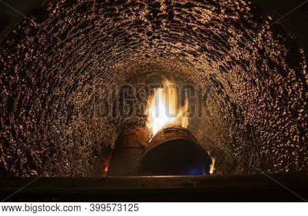 Tar Deposit Inside The Wood Fuel Boiler. Shinny Black Deposit Inside The Solid Fuel Boiler. Creosote