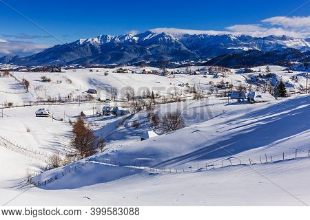 Winter In Pestera Village. Rural Landscape In The Carpathians, Romania.