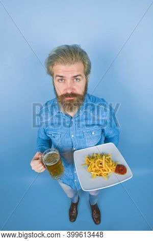 Street Food. Fast Food. Man With Potato Fries. Beer. French Fries Potato. Man Drinking Beer And Eati