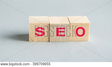 Seo Search Engine Optimization, Text On Wooden Cubes, On A Gray Table, The Concept Of Minimalism. Id
