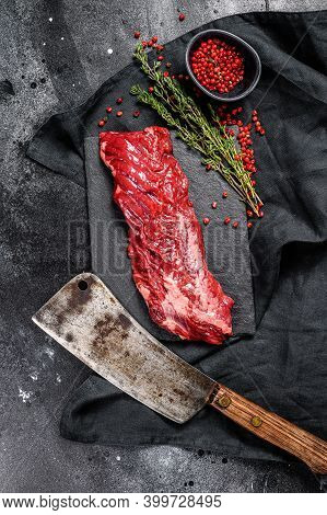 Raw Skirt, Machete Steak With Pink Pepper And Thyme. Black Background. Top View