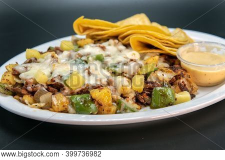 Alambre Plate Of Grilled Meat, Chopped Vegetables, And Melted Cheese Served With Corn Tortillas And 