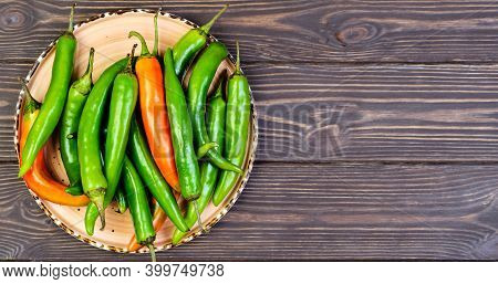 Spicy Mexican Peppers On A Platter. Spanish Tapas On Wooden Vintage Background. Flat Top View With C