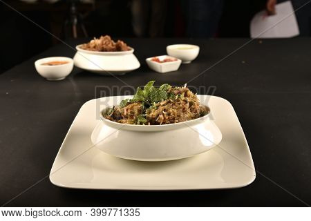 Chicken Biryani Of Bengal Served With Salad And Raita