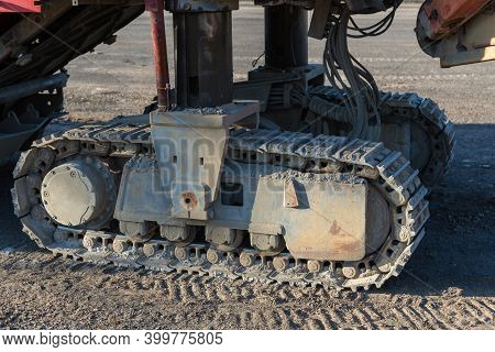 Excavator Tracks. Old Iron Caterpillars Of The Bulldozer Of The Tractor On The Road. Bulldozer Cater