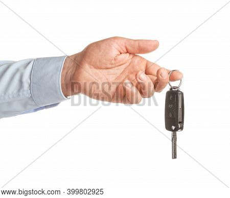 Male Hand With Car Key On White Background