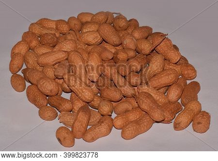 Peanuts Or Groundnuts Or Nuts In Shell Isolated On Light Grey Background.  Also Known As Moongfali  