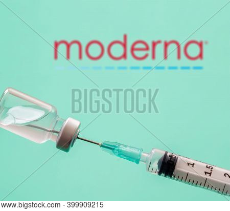 Modena Logo On Blue Background, Covid19 Vaccine Vial And Syringe, Coronavirus Immunization